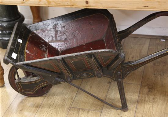 A painted wheelbarrow Length 100cm